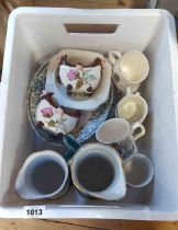 A crate containing a quantity of ceramics including jugs, commemorative china, etc.