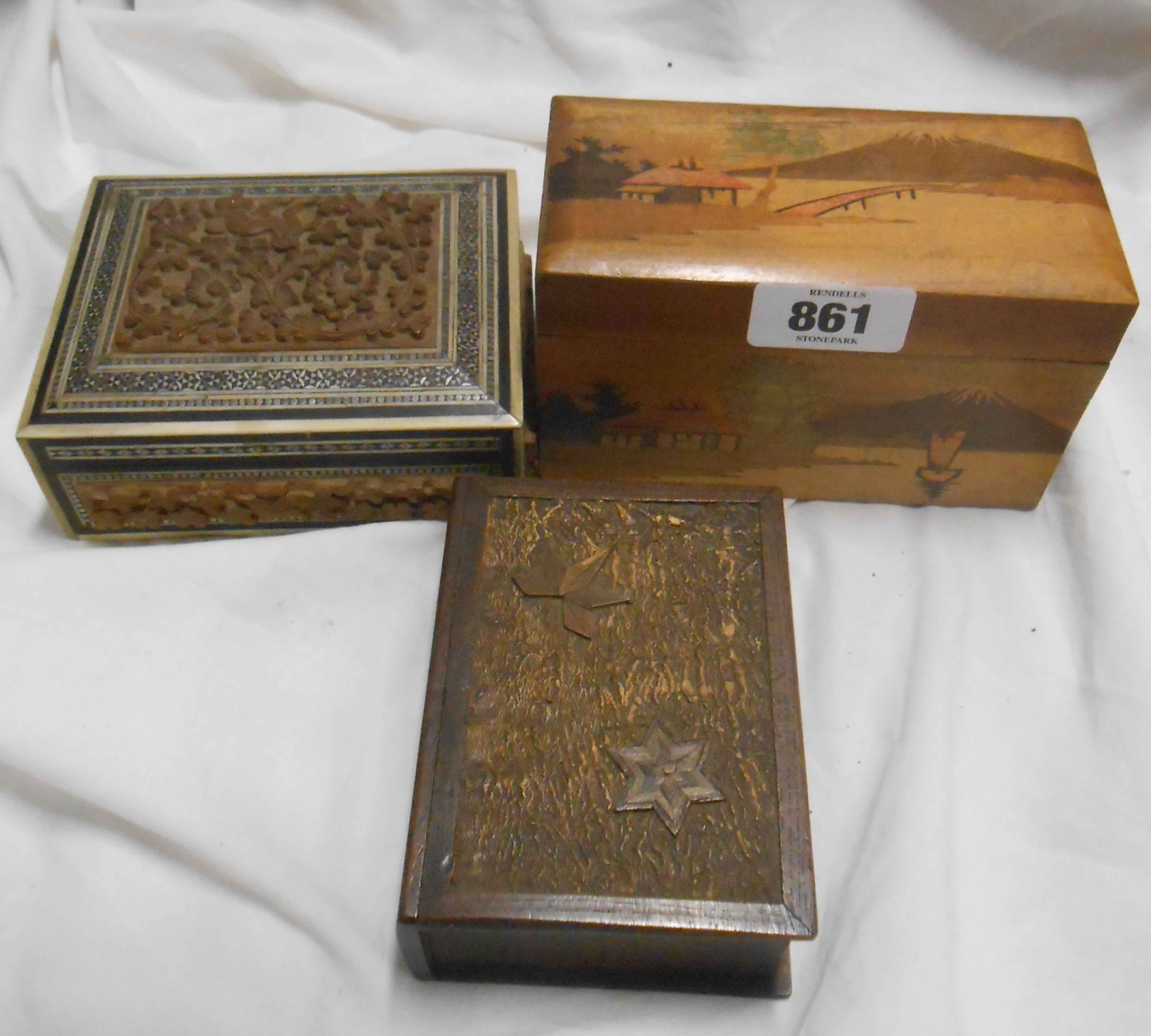 A vintage Oriental cigarette box - sold with two other decorative boxes and a faux tortoiseshell