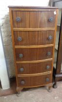 A 46cm vintage mixed wood bow front narrow chest with flight of five drawers, set on short