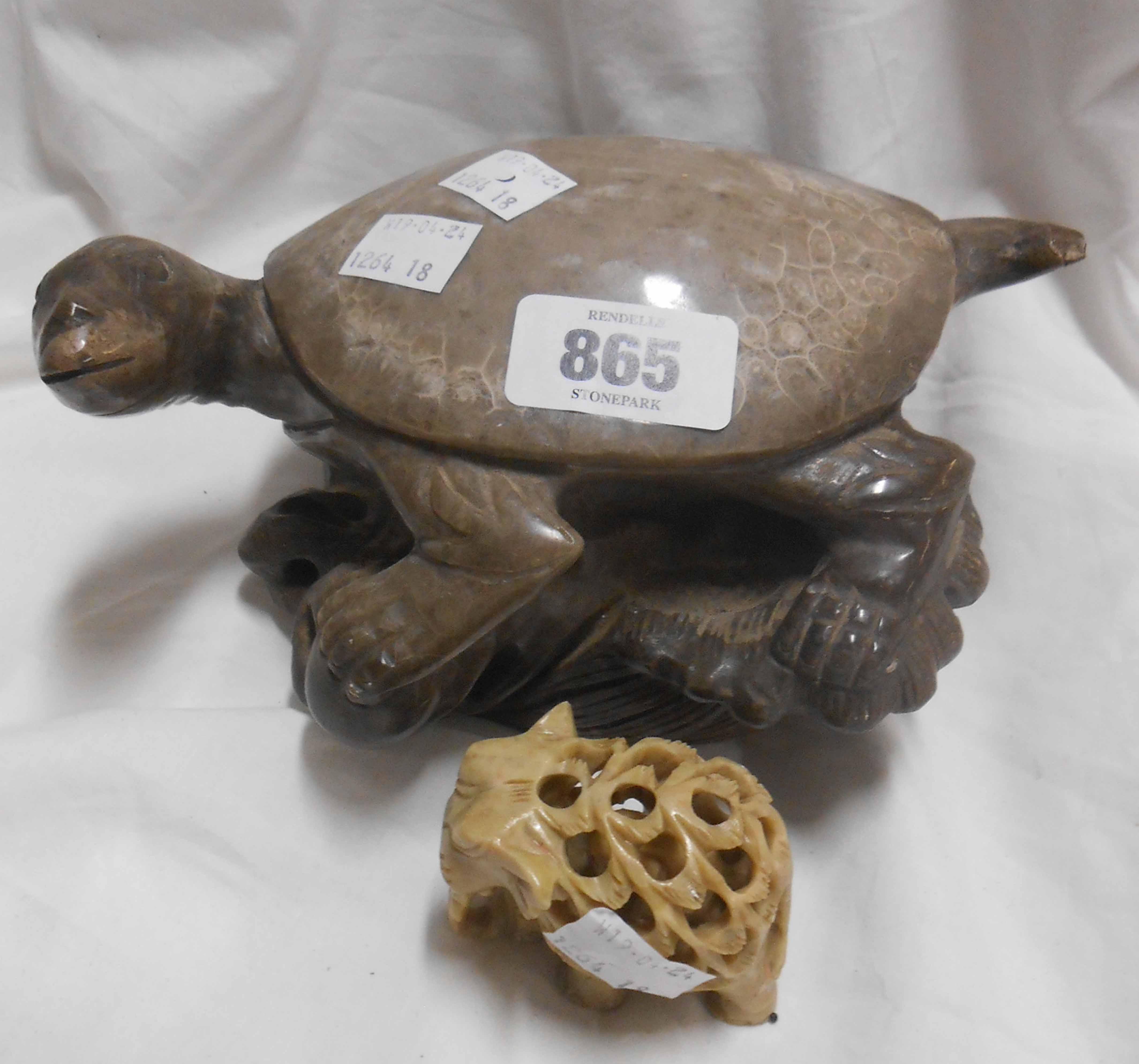 A Chinese carved soapstone turtle perched upon a rock - sold with a smaller similar elephant