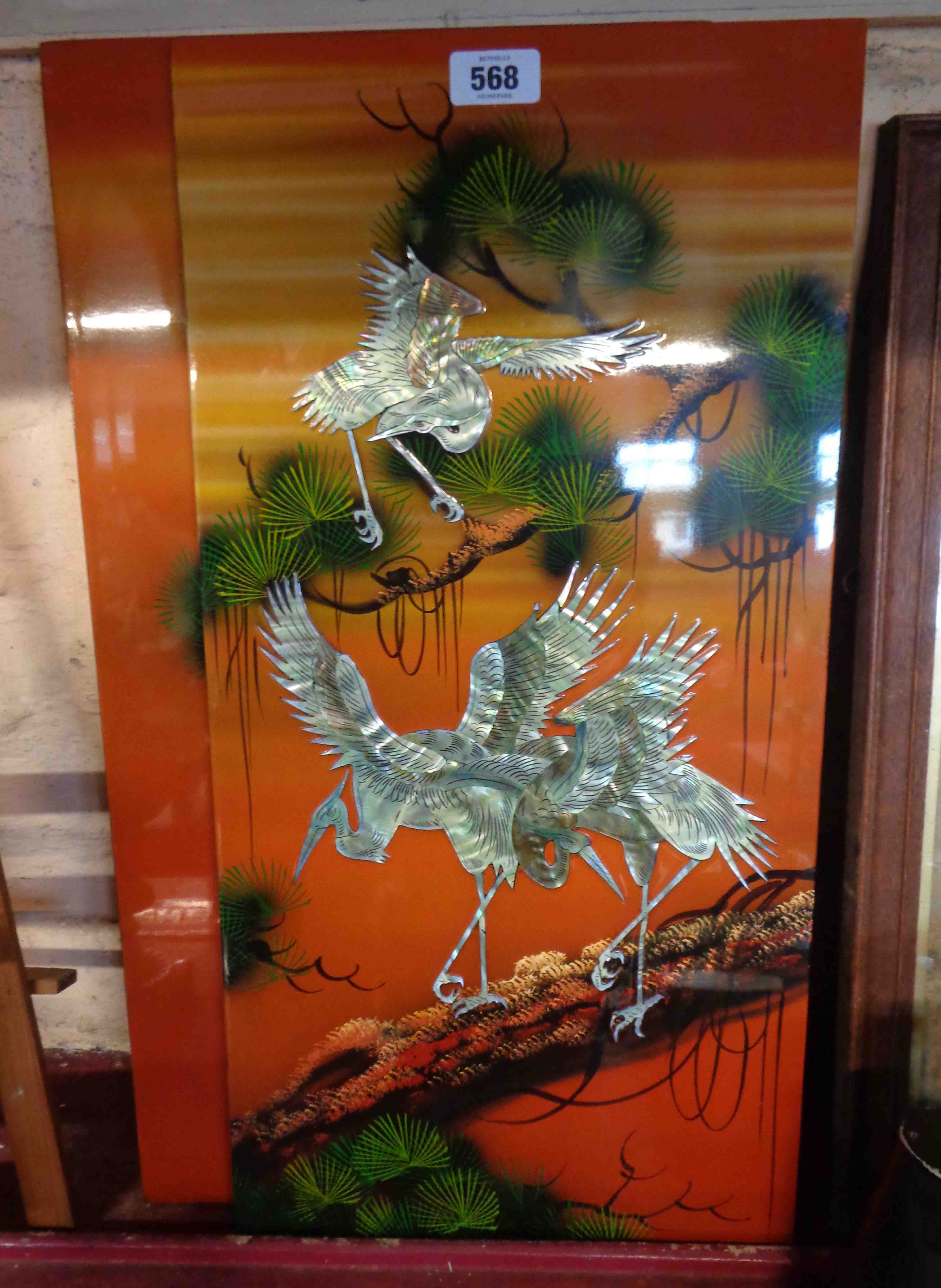 A Vietnamese four section screen with mother-of-pearl and lacquered decoration, depicting birds,