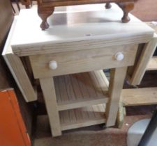 A 73cm modern mixed wood butcher's block with marble top, drop sides and single deep drawer, set