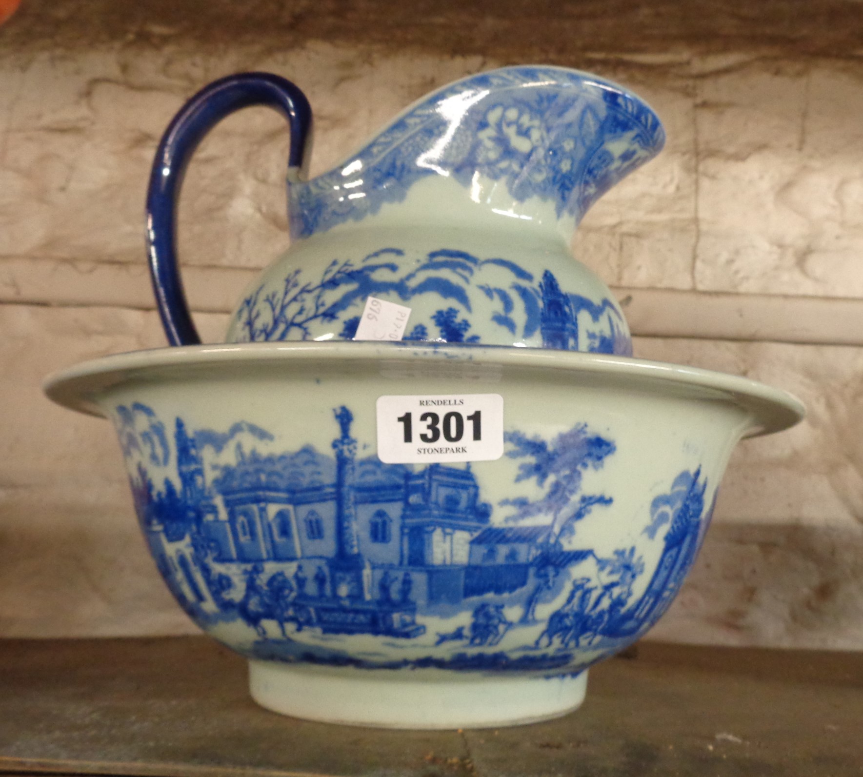 A modern pottery toilet jug and bowl with blue transfer printed decoration