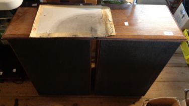 A pair of KEF kit speakers in wooden cases with an envelope containing related paperwork
