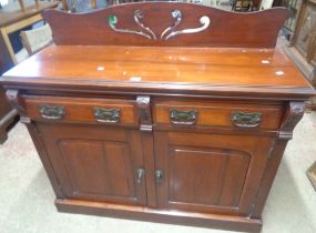 A 1.22m late Victorian stained walnut chiffonier with later added pierced raised back, two frieze