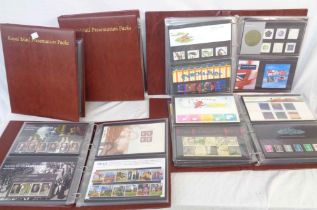 Five Royal Mail Presentation Packs ring bound albums containing a collection of mint decimal stamp