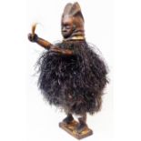 A carved wooden Mende figurine from Sierra Leone