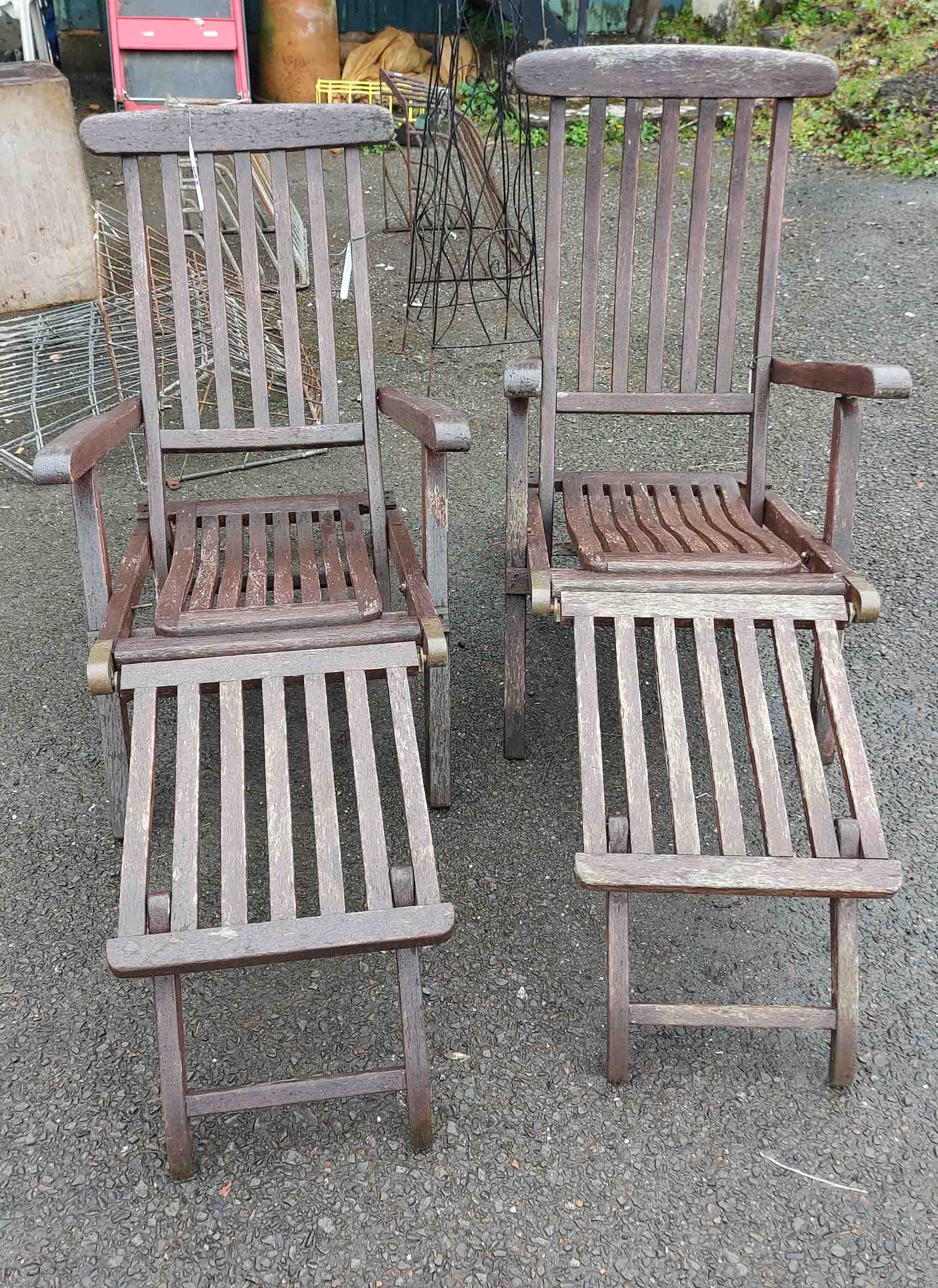 Two wooden garden lounger chairs