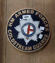 A modern 'HM Armed Forces Coldstream Guards' painted cast iron sign