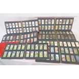 Eleven vintage 'Wills's Cigarette Card Albums' containing collections of mainly John Player and