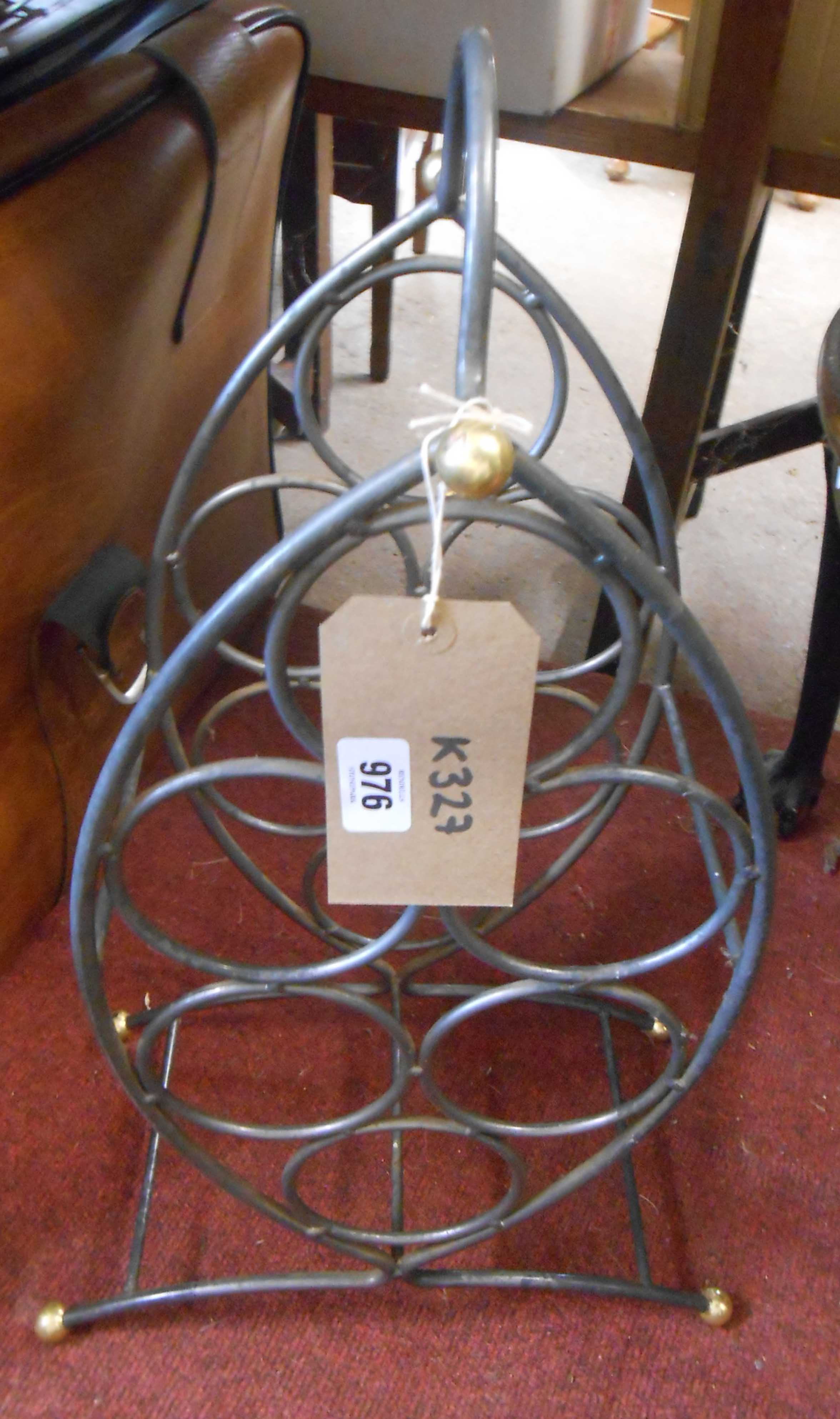 A small vintage metal wine rack