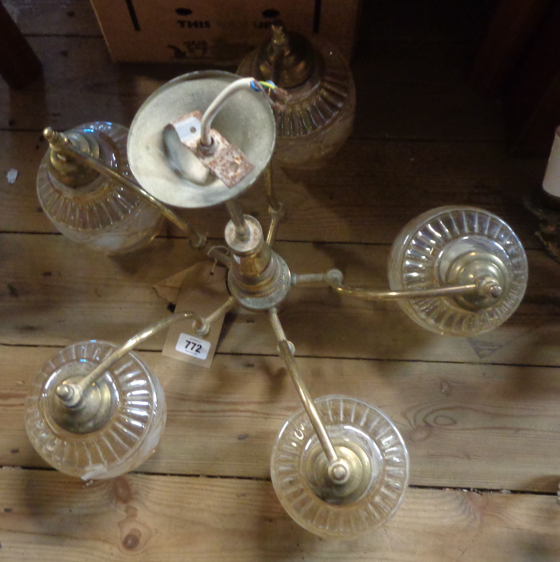 A large brass five branch electrolier with amber and frosted moulded glass shades