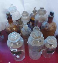 A quantity of 19th Century chemists' bottles and stoppers, of various size with applied gilt