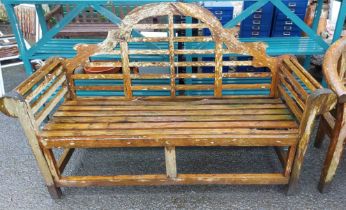 A Lutyens style wooden garden bench