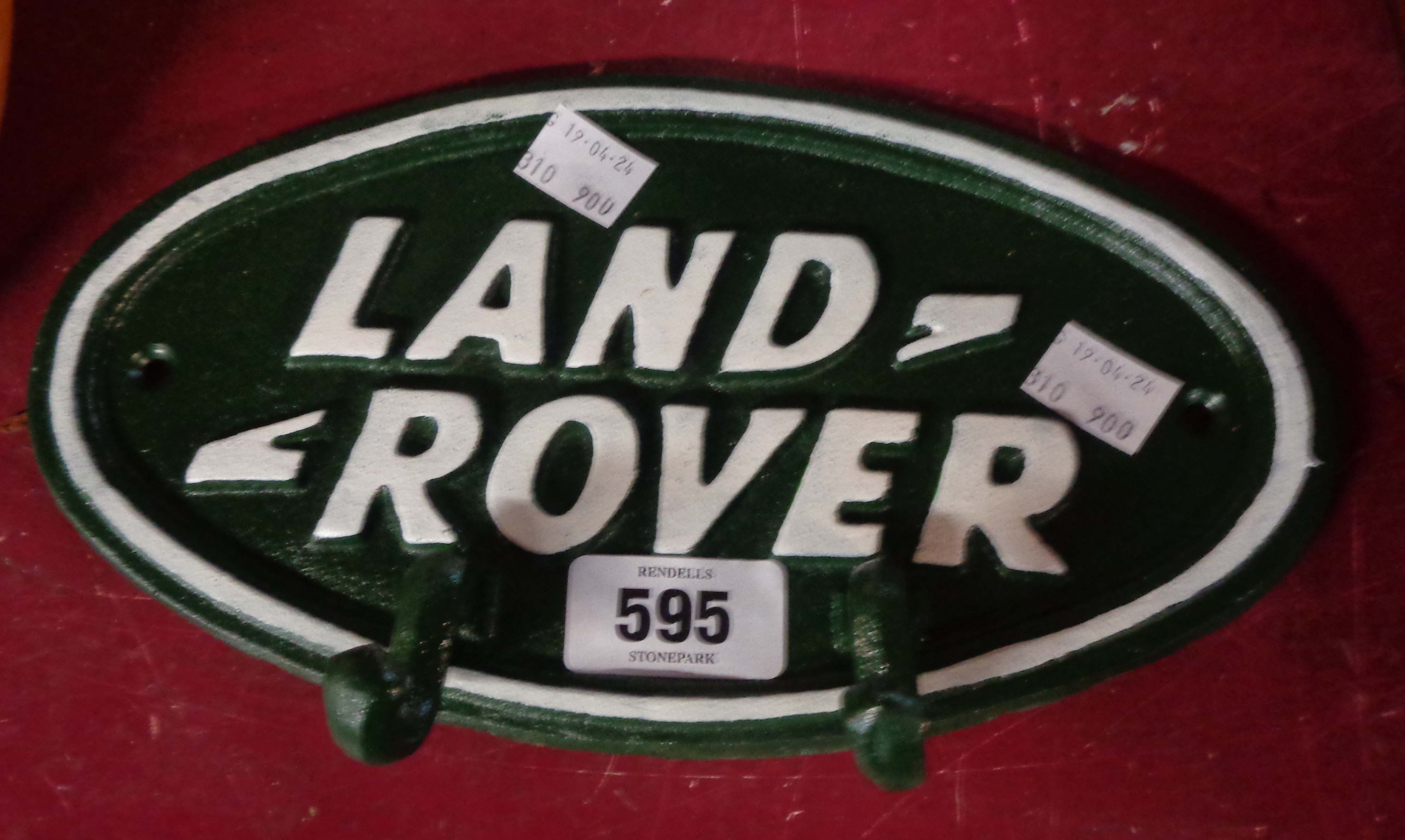 A modern cast iron 'Land Rover' wall hooks plaque