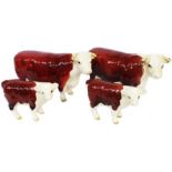 Two Beswick Hereford Champion of Champion cow figurines - sold with two Hereford calves