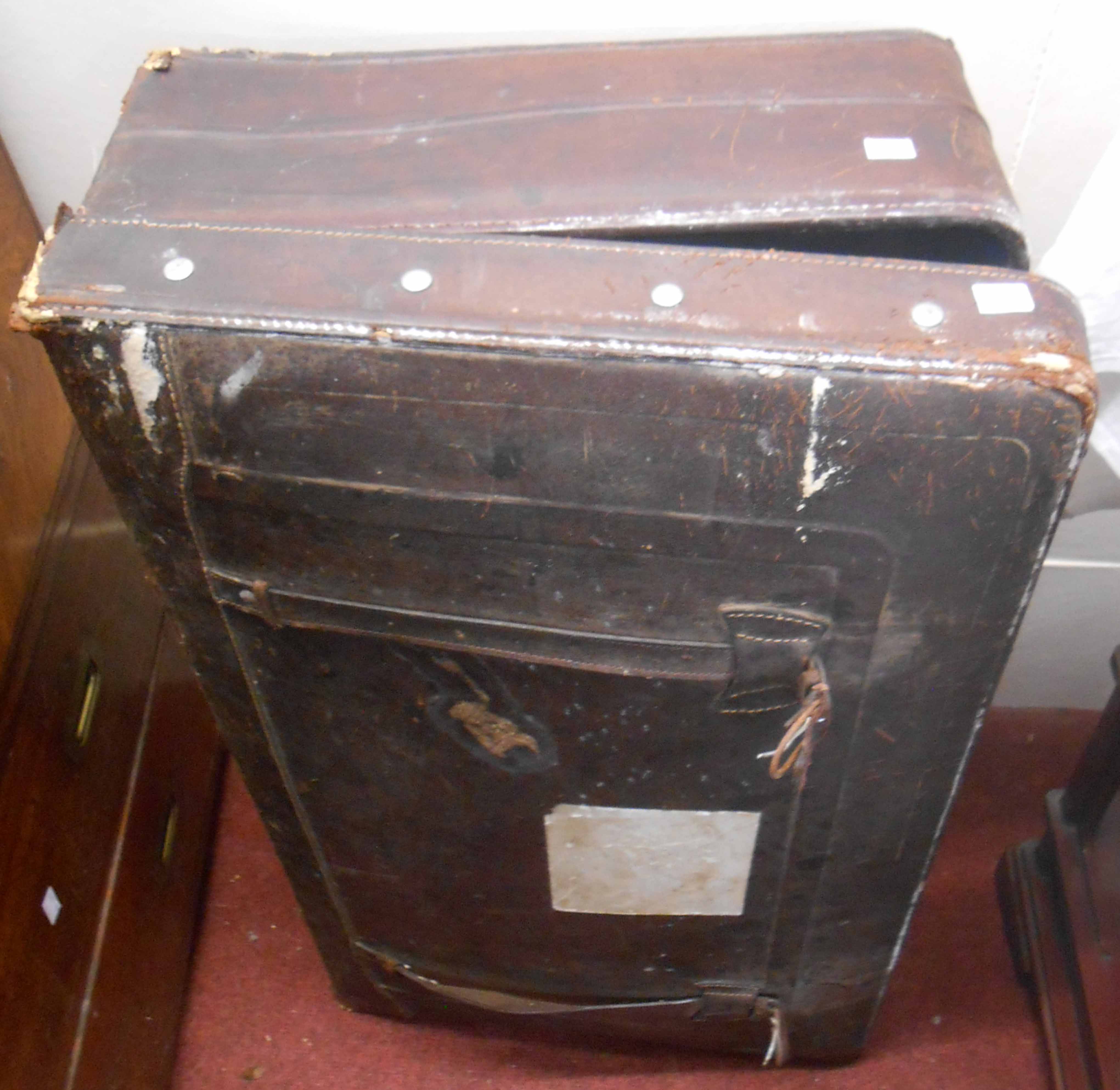 An old leather bound suitcase - sold with vintage leather suit cover