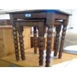 Two vintage oak nesting tea tables, set on slender bobbin turned legs