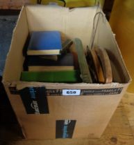 A box containing a quantity of vintage hardback books and three wooden coat hangers