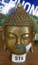 A modern brass Buddha head