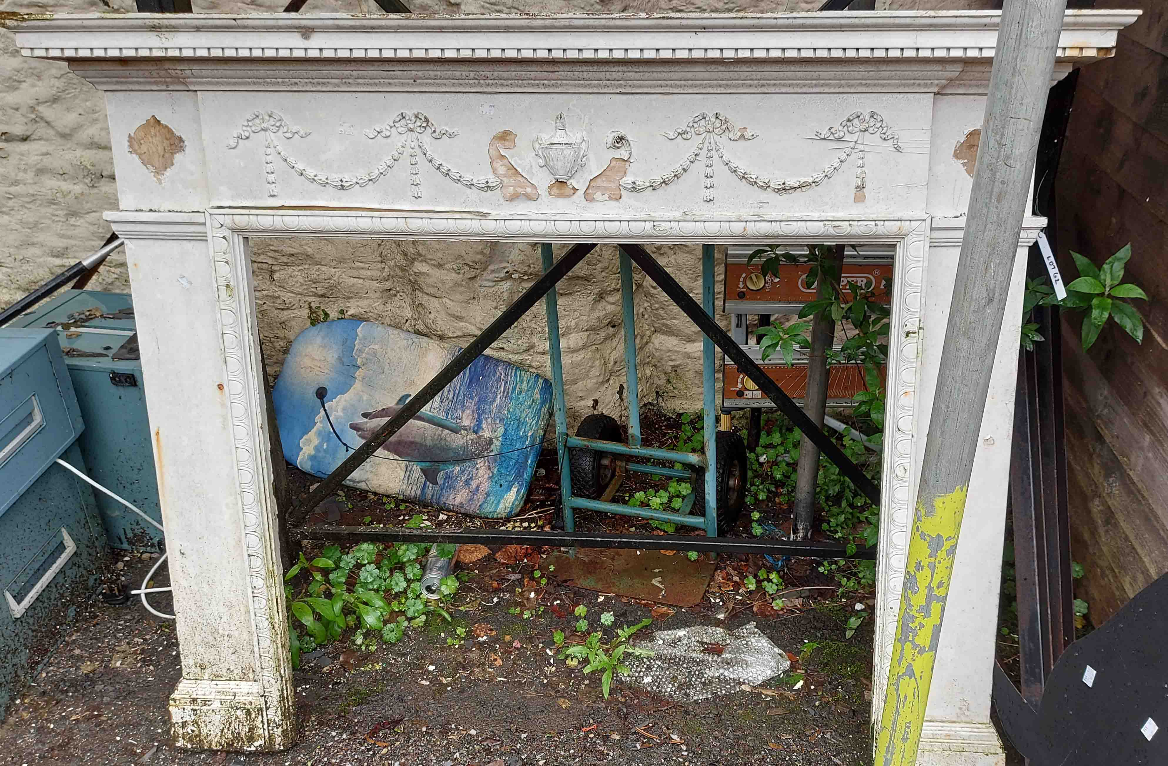 A late Victorian white painted wood fire surround