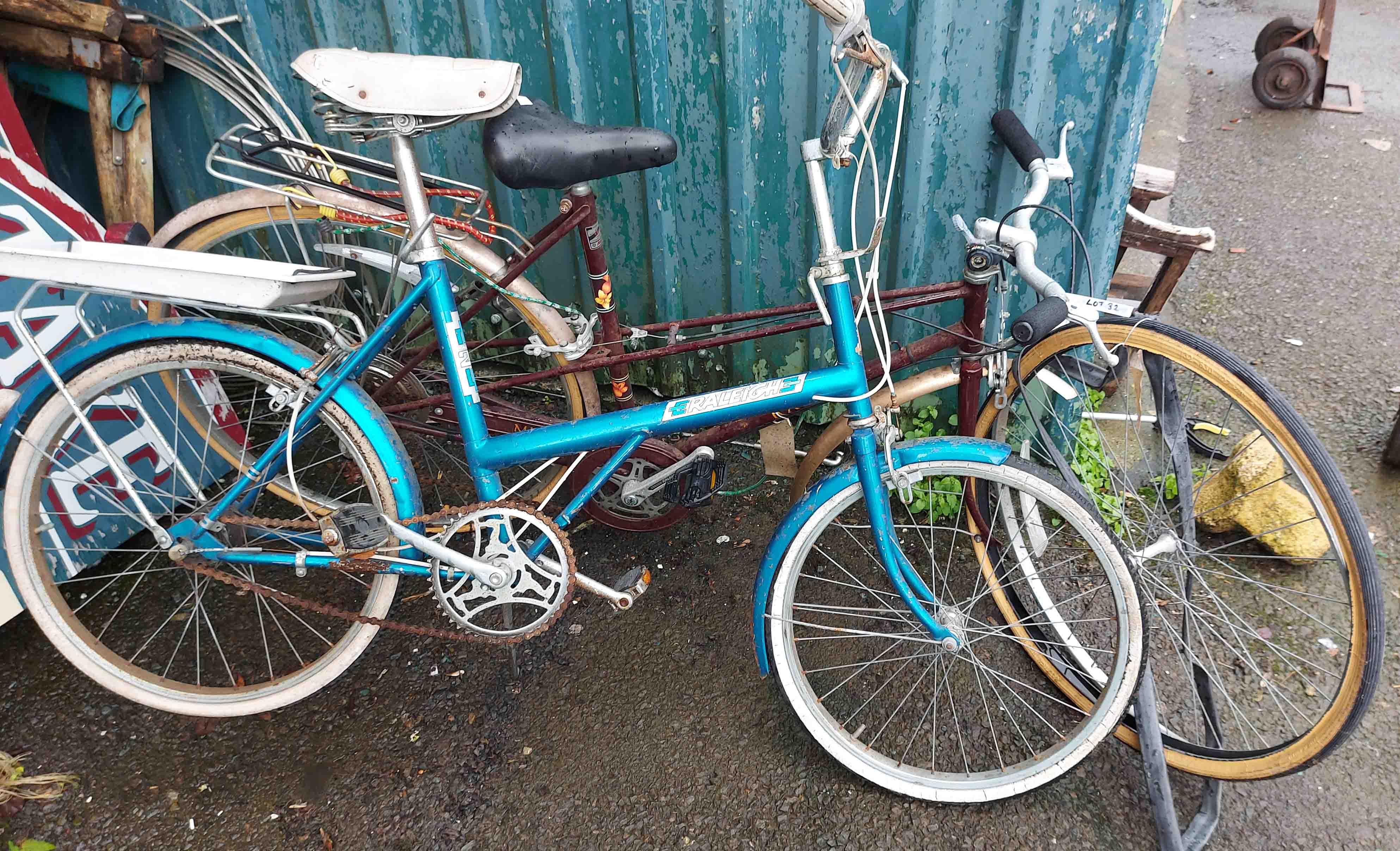 A vintage Raleigh bicycle in maroon colourway - sold with another similar in teal colourway