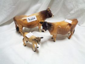 A Beswick pottery Jersey cattle family comprising bull, cow and calf