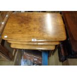 A vintage Remploy nest of three walnut tea tables