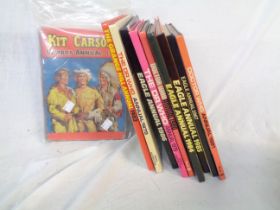 A box containing a collection of vintage annuals including Dr. Who, 1958 Kit Carson's Cowboy