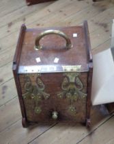 A Victorian mahogany slope fronted coal box with brass strapwork attributed to Dr. Christopher
