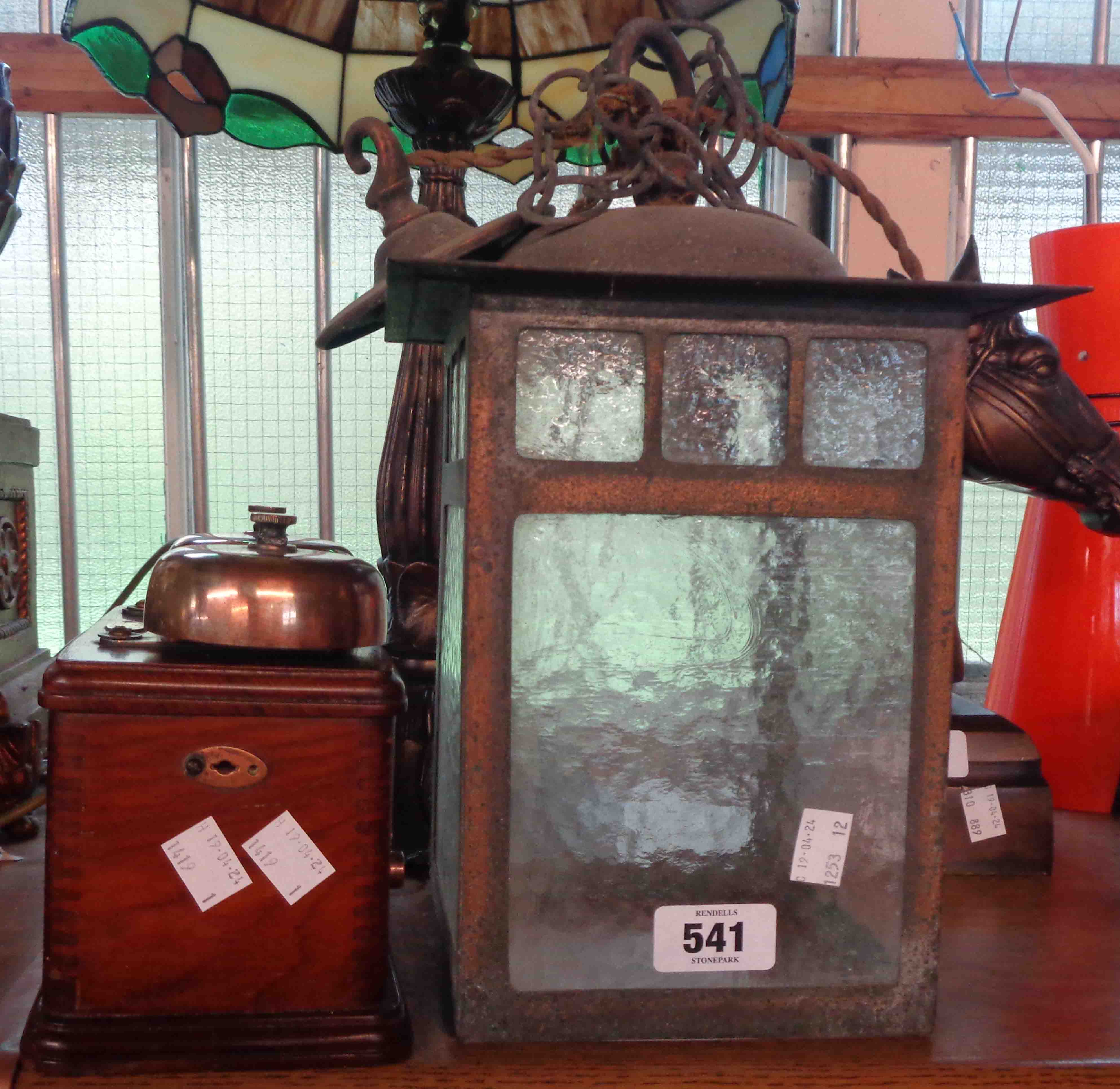 A vintage glass and copper porch lantern