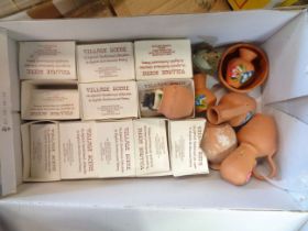 A shoebox containing a quantity of ceramics including eleven boxed 'Village Scene' Craft Pottery
