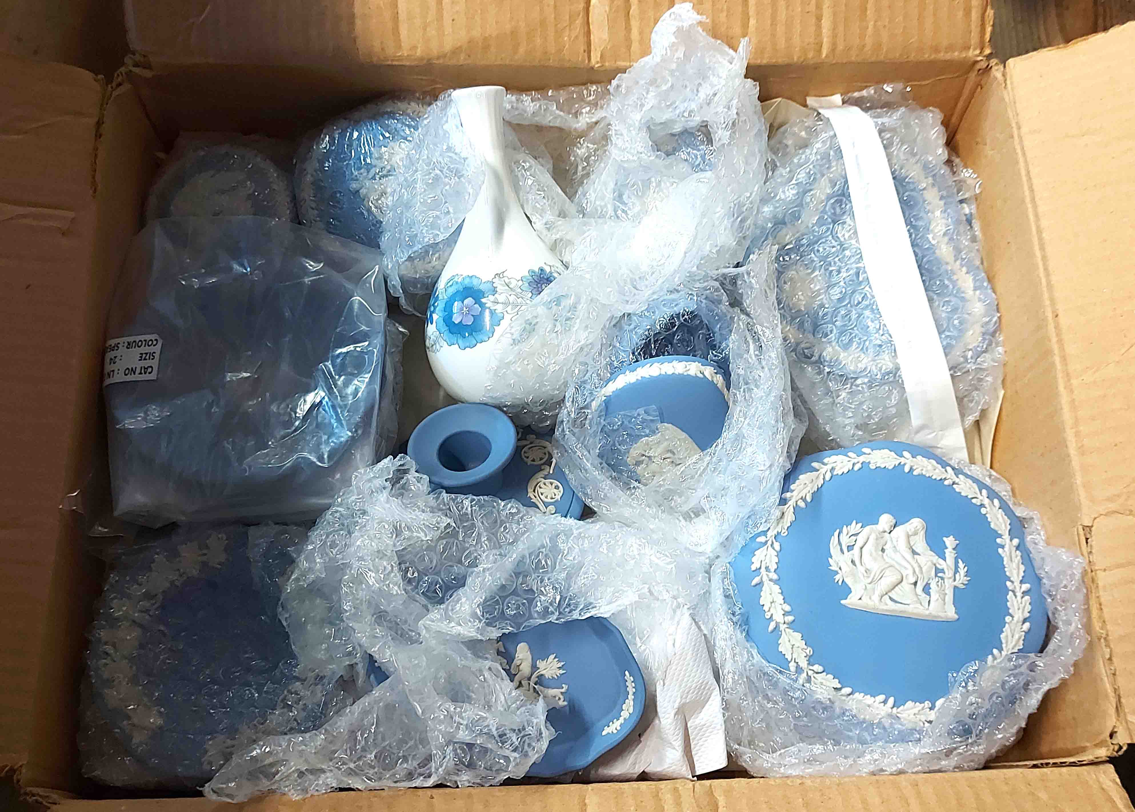 A box containing a quantity of Wedgwood blue Jasperware and bone china items including lidded boxes,