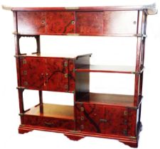A 1.14m 20th Century Japanese decorative red lacquered sideboard with sliding doors to top and an