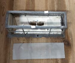 A metal wall light of cage form with glass panels - two panels missing