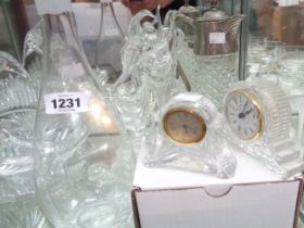 A small quantity of glassware including clocks, claret jug with silver plated fittings, etc.