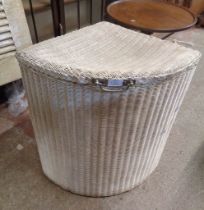 A vintage Lloyd Loom corner laundry basket with white painted finish and original label