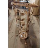 A wrought iron umbrella stand