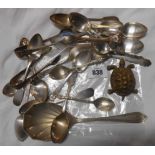 A bag containing quantity of silver plated spoons and brass tortoise