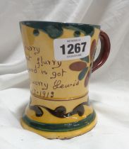 An early 20th Century Aller Vale Torquay pottery mug with central motto - bearing incised