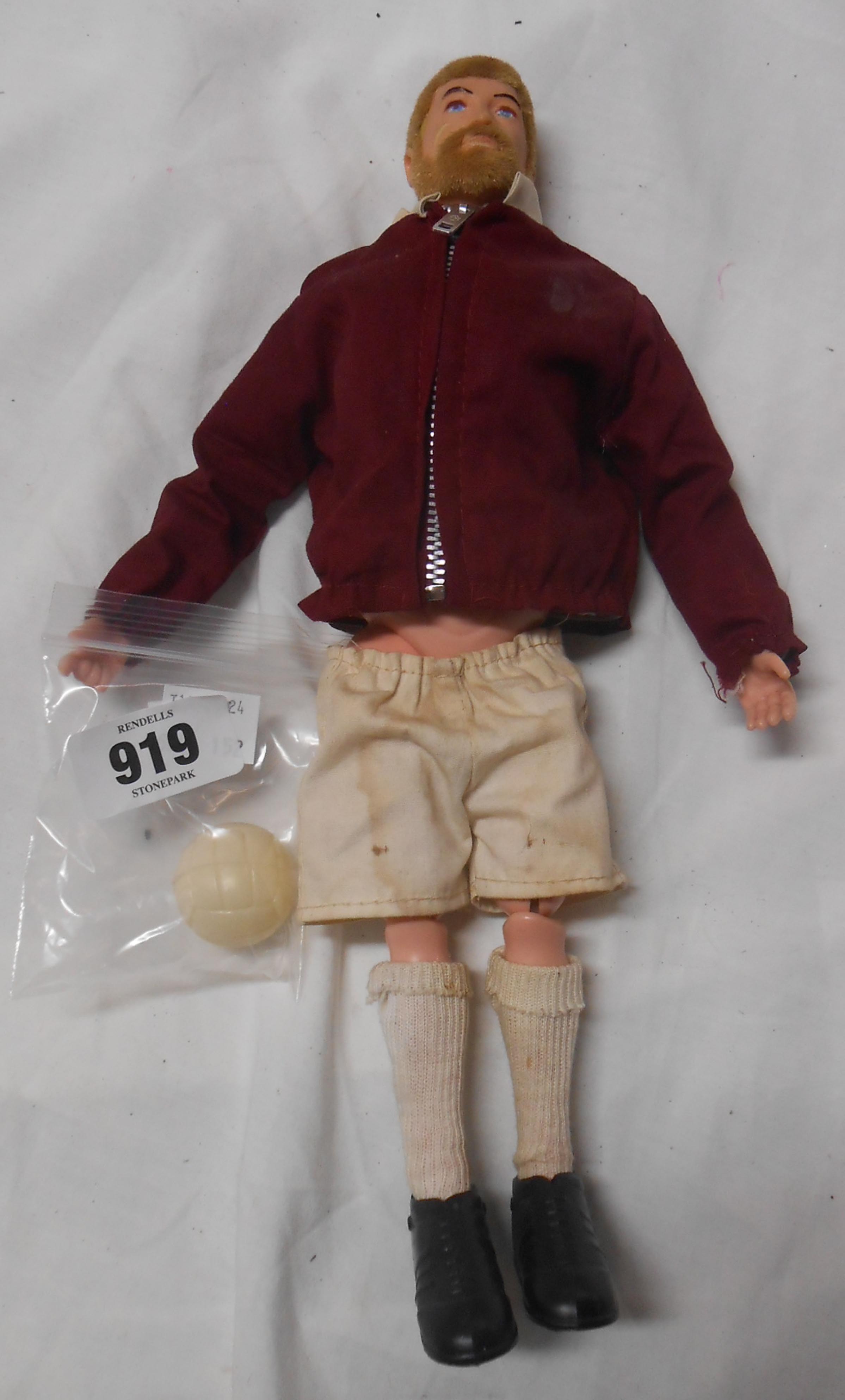 A vintage Action Man footballer in earlier West Ham strip complete with original football