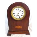 An Edwardian inlaid mahogany dome-top mantel timepiece with gilt bezel and eight day movement