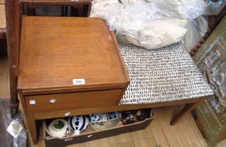An 86cm vintage 'Chippy' teak effect telephone table with upholstered seat, slide and fall-front,