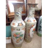 A pair of very large 20th Century Chinese porcelain vases with floral and trellis decoration on a