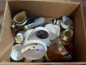 A box containing a small quantity of decorative ceramics