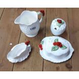 Four pieces of Caverswall bone china, decorated in the leaf and berry range comprising milk jug,