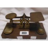 A set of antique wood and brass postal scales