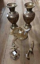 A quantity of brassware consisting of two vases, a door knocker, porch bell and a brass monkey