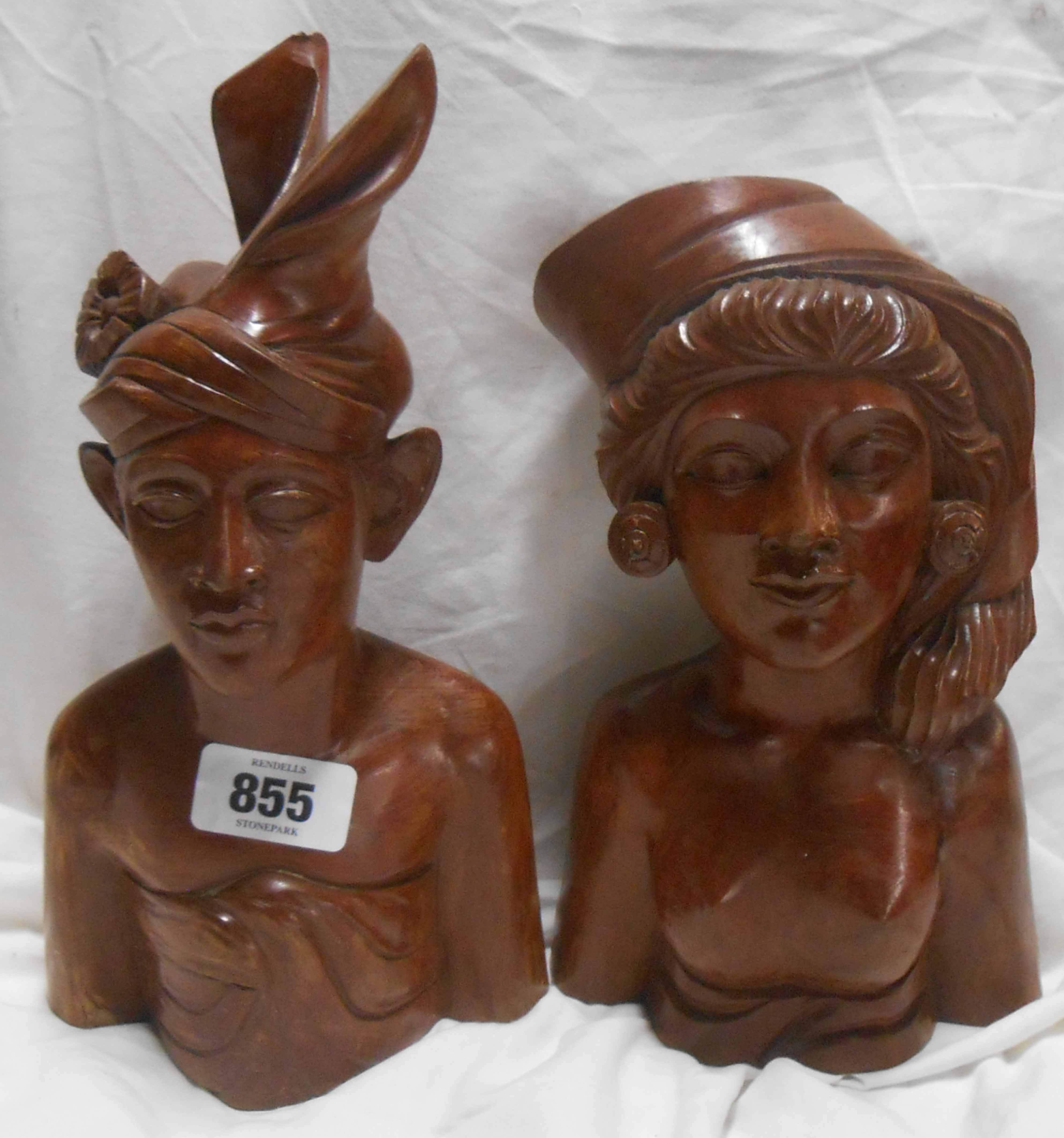 A pair of Indonesian carved hardwood busts