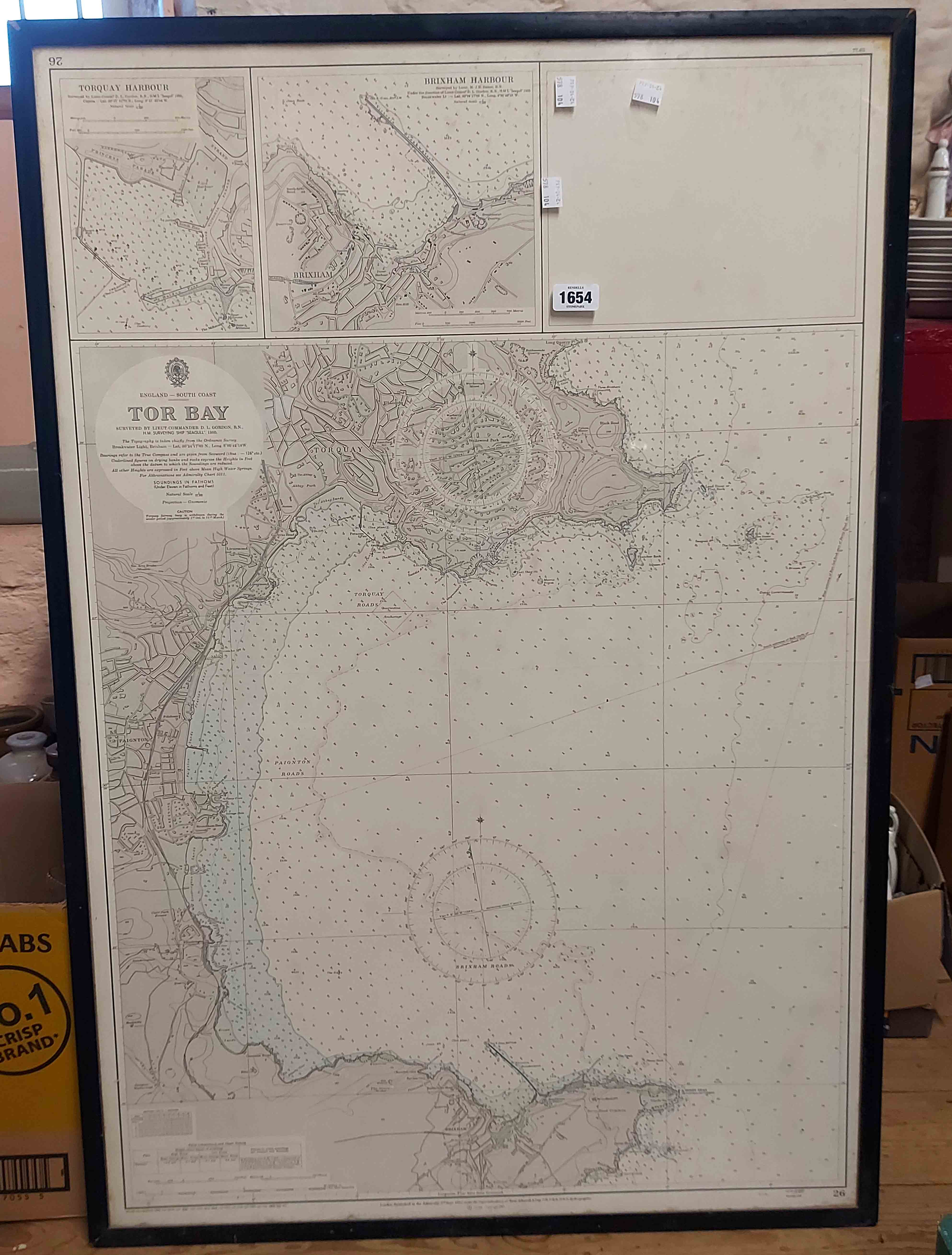 A framed large format monochrome Admiralty chart with coastal water depths and other information,